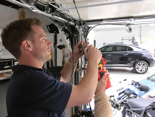Kendall Garage Door Repair safety certified technician performing cable replacement in Kendall