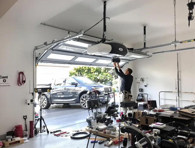Kendall Garage Door Repair specialist installing smart garage door opener system in Kendall home