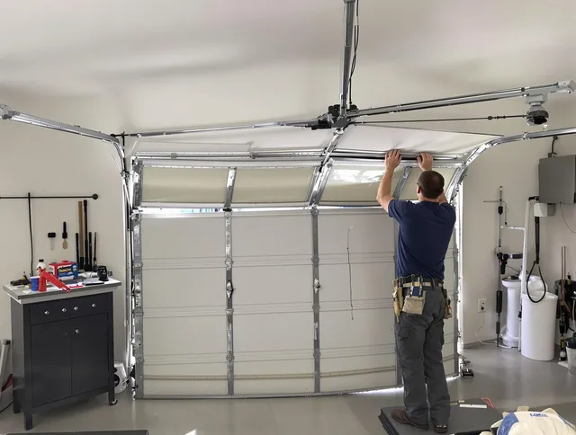 Kendall Garage Door Repair specialist performing precise section replacement on Kendall garage door